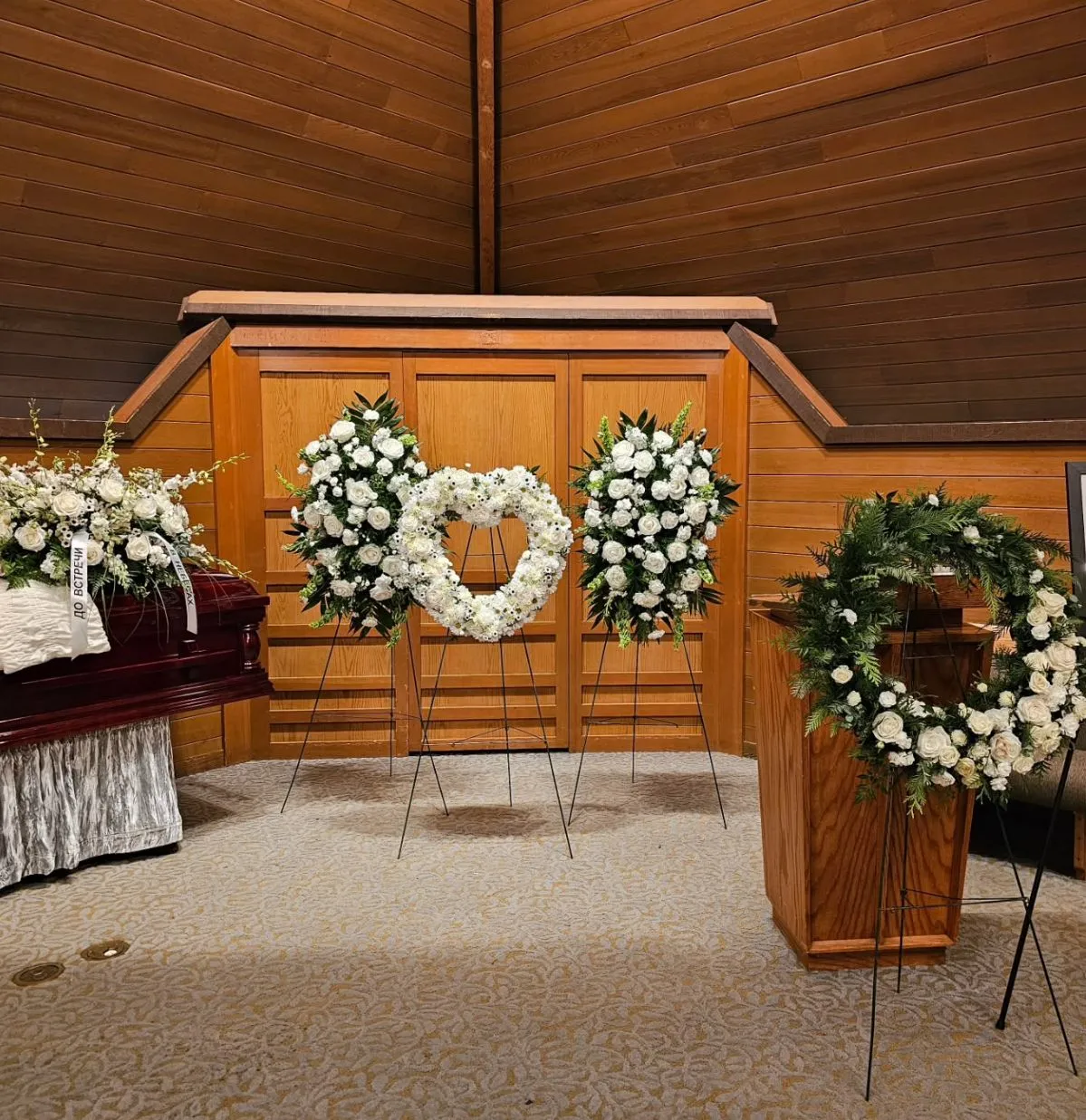 Full venue floral setup with heart wreath designed and delivered by Vancouver Funeral Florals