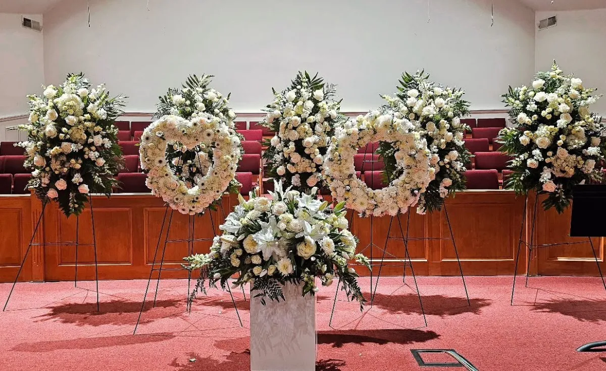 Heart wreath tributes at a church for a Hazel Dell WA funeral service