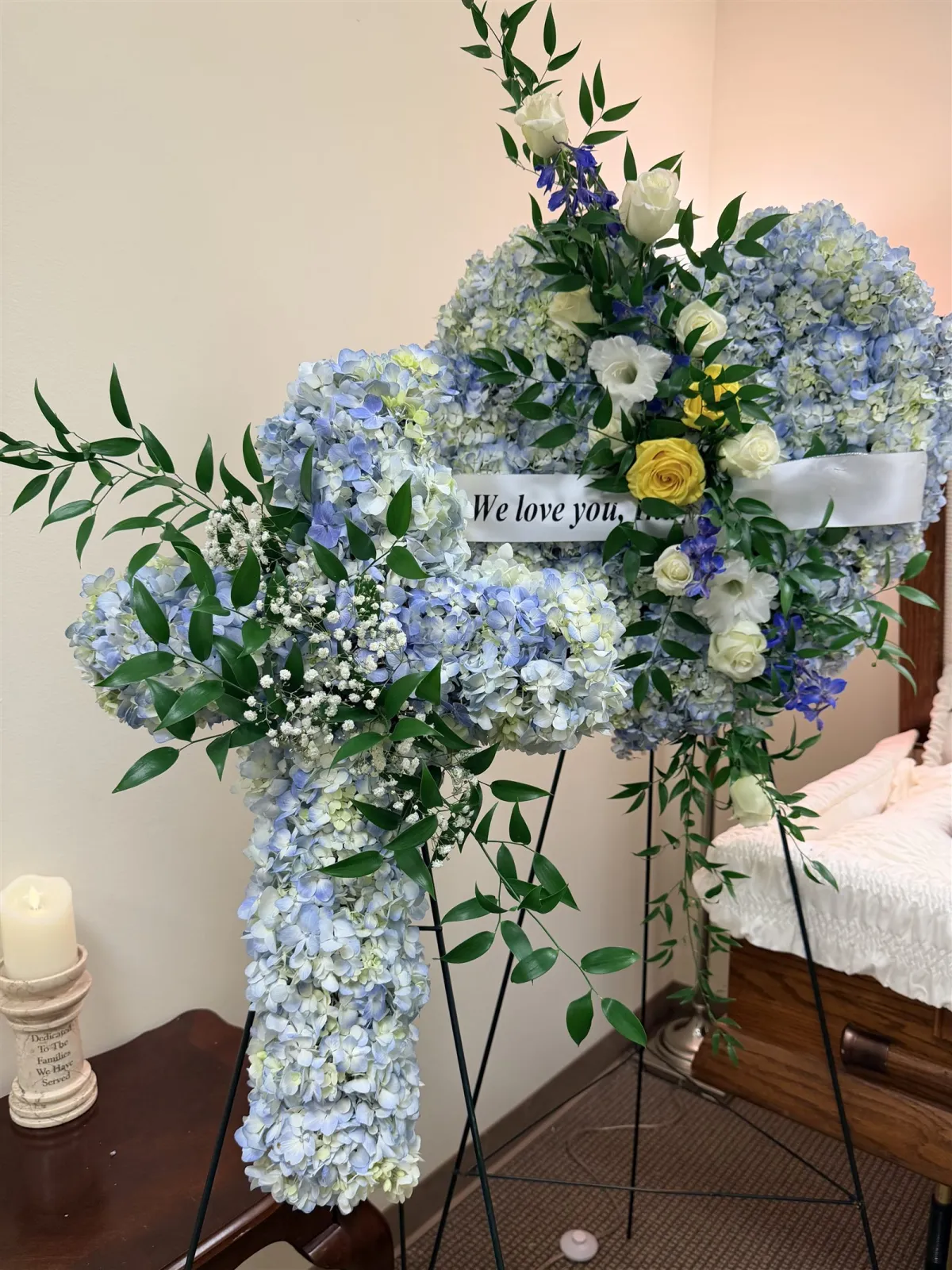 Flower cross and heart tribute arrangements at a chapel service at Evergreen Staples Funeral Home Vancouver WA