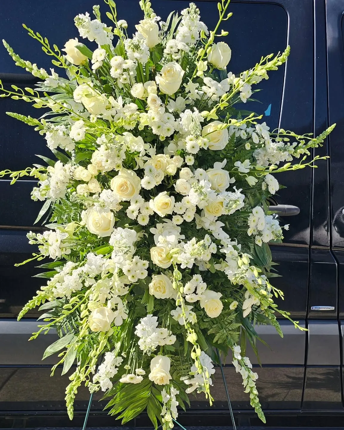 White standing spray on an easel for a Ridgefield WA funeral service