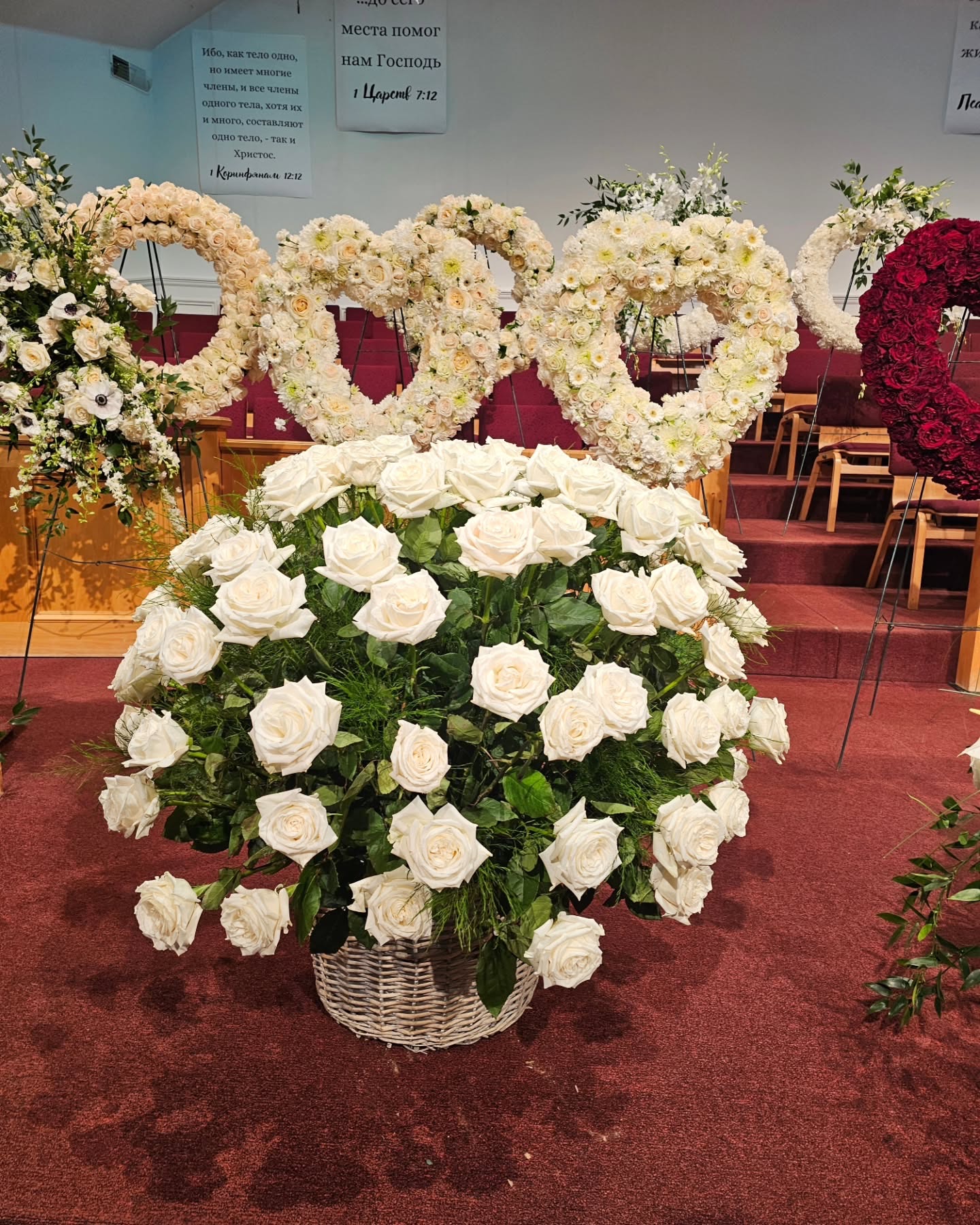 Urn arrangement with soft pink and white flowers